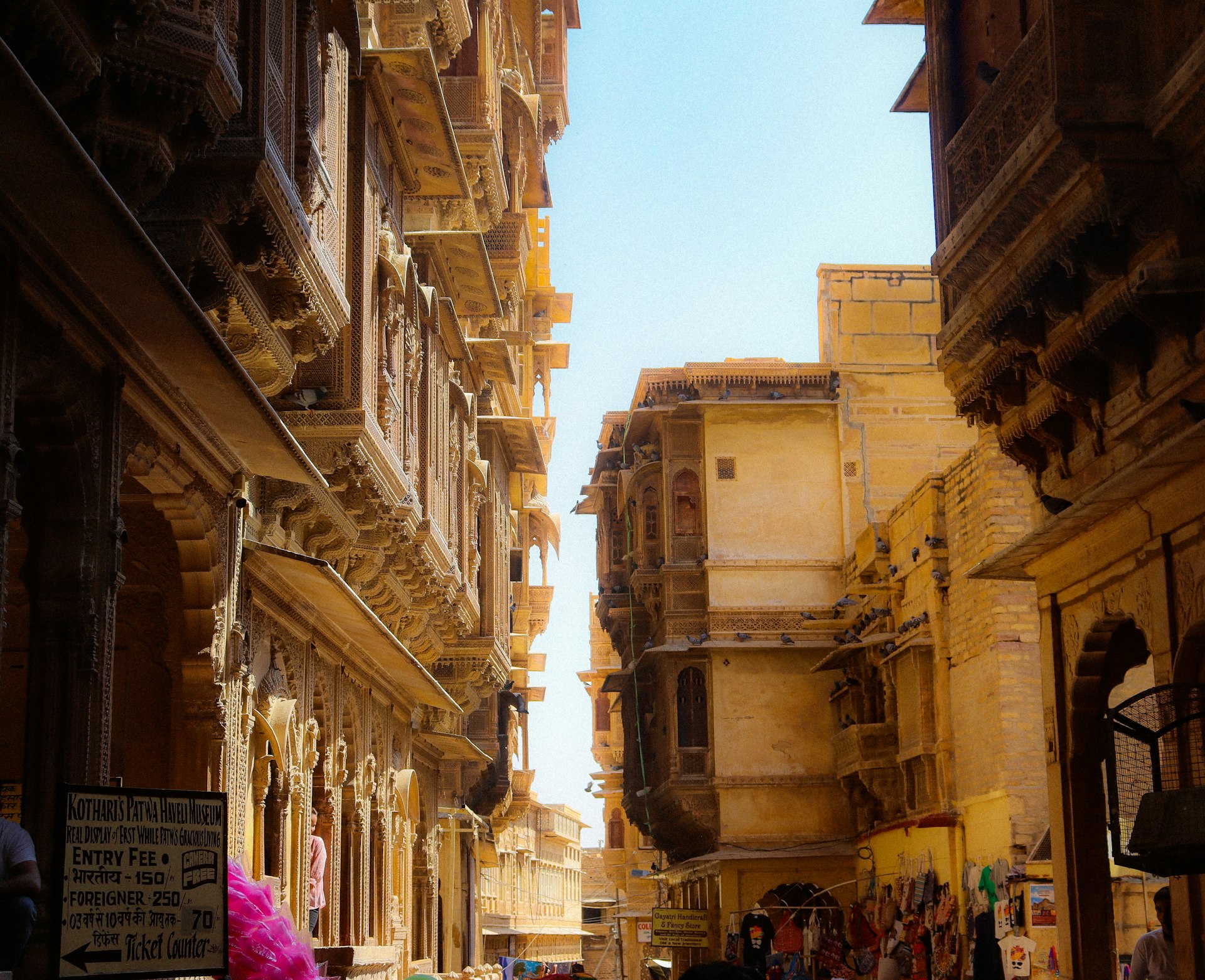 a narrow street in a city with old buildings